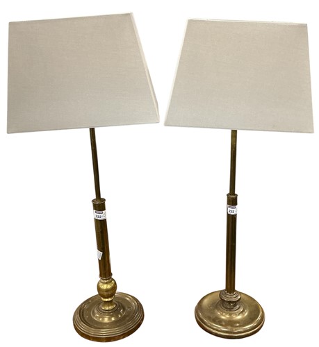 Lot 222 - A near pair of brass lamps, 53cm high to the...