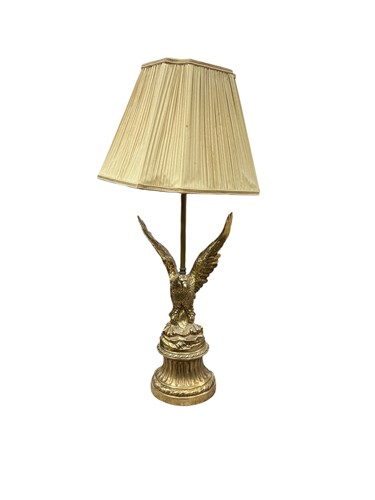 Lot 205 - A cast brass 'eagle' table lamp, with pleated...