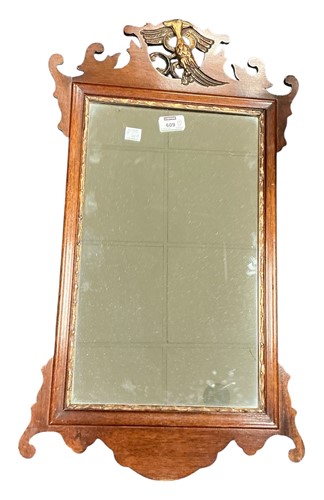 Lot 609 - An oval Florentine style mirror with pierced...