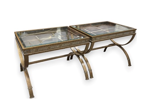 Lot 554 - A pair of antiqued and gilt metal tables, with...
