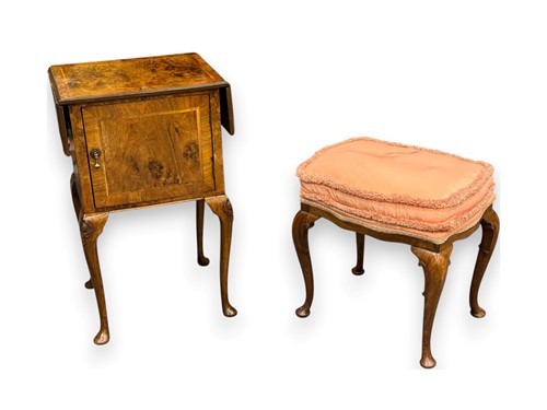 Lot 645 - A 1920s walnut drop flap bedside cupboard on...