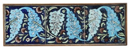 Lot 52 - Attributed to William De Morgan, a framed panel of three Arts & Crafts tiles