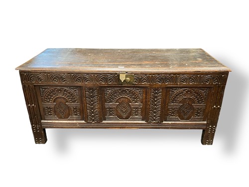 Lot 622 - An 18th century carved oak coffer chest, the...