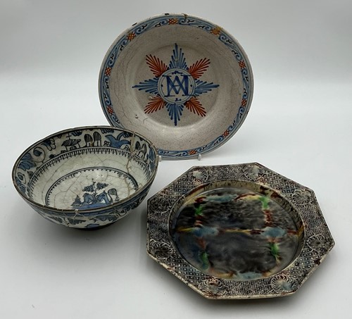 Lot 23 - An 18th century tin glaze dish with central...