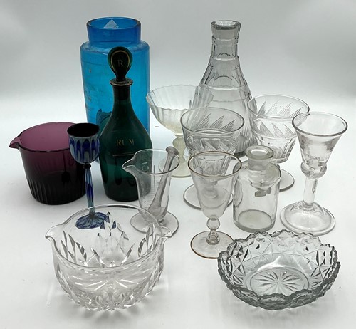 Lot 119 - A 19th century green glass rum decanter, a...