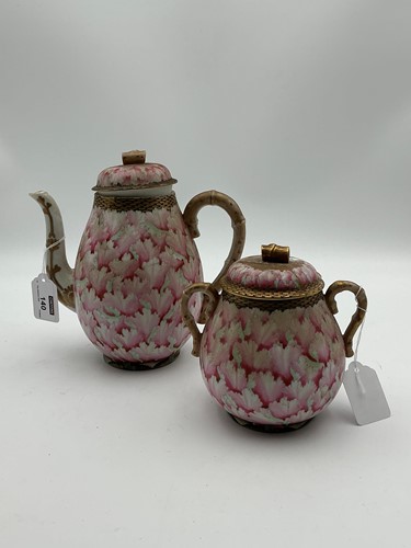 Lot 140 - A Chinese teapot and cover and sucrier and...