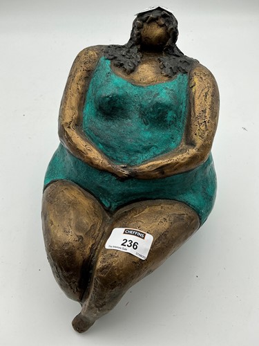 Lot 236 - A bronze sculpture of a seated female figure...