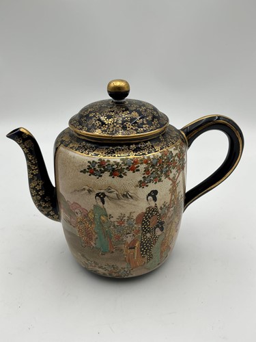 Lot 163 - A Japanese satsuma teapot and cover, 17cm high
