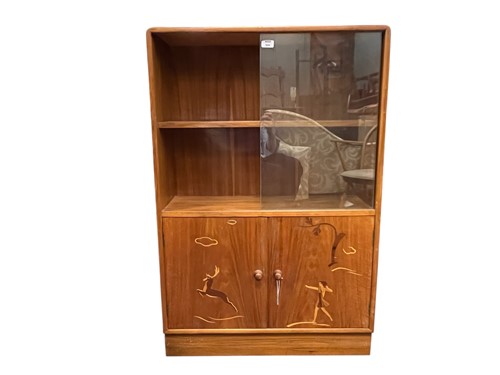 Lot 604 - An Art Deco cabinet with shelves and cupboard,...