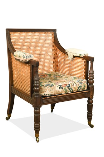 Lot 524 - A mahogany bergère library armchair, early 19th century