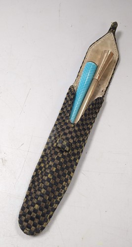 Lot 318 - A 9ct gold cigarette holder, 9.5g gross, along...