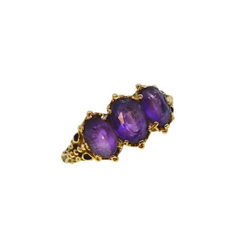 Lot 24 - A 9ct gold three stone amethyst ring