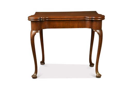 Lot 499 - A mahogany fold-over card table, 18th century
