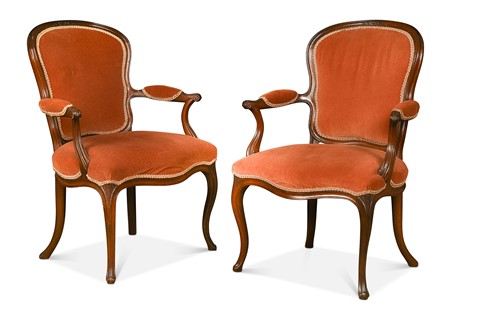 Lot 741 - A pair of Georgian Louis XV style mahogany armchairs