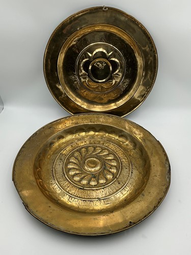 Lot 144 - Two German brass alms dishes, probably 17th...