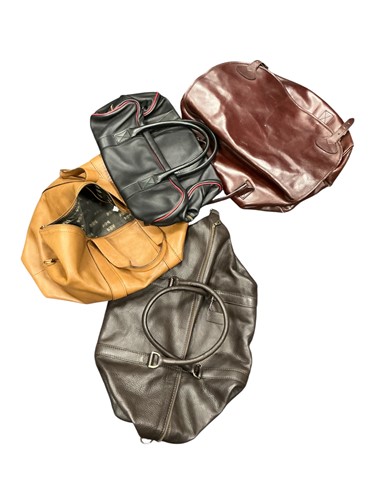 Lot 177 - A Swaine Adeney leather holdall and three others