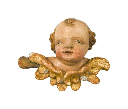 Lot 378 - A carved and polychrome-painted cherub head, 18th century