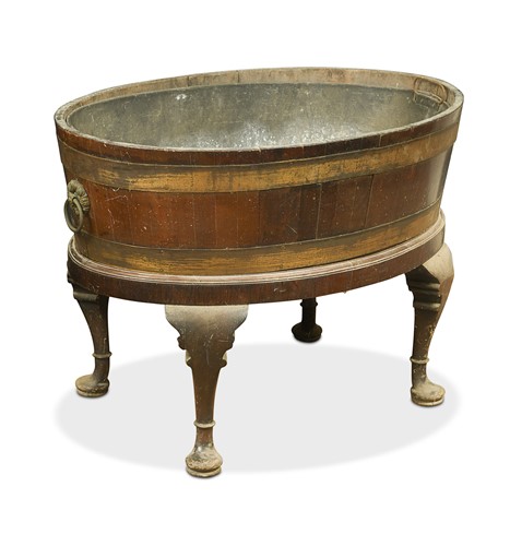 Lot 473 - A George III mahogany oval wine cooler