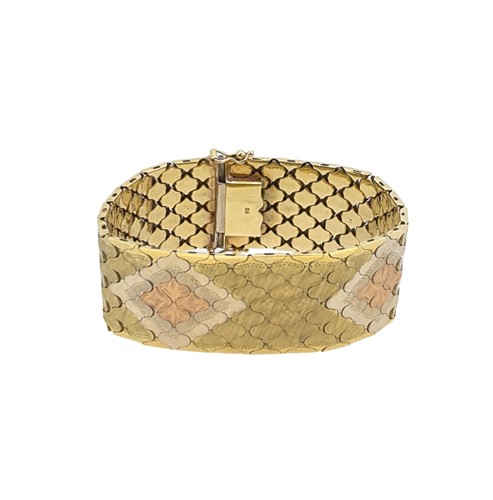 Lot 84 - A three colour wide bracelet