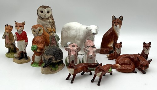 Lot 31 - A collection of mostly Beswick models of foxes,...