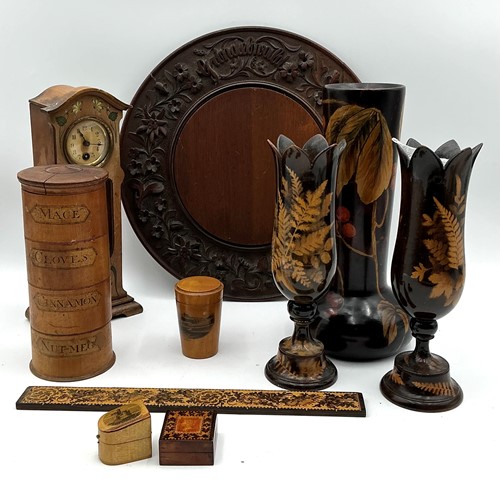 Lot 146 - A Grindelwald carved breadboard, a treen spice...