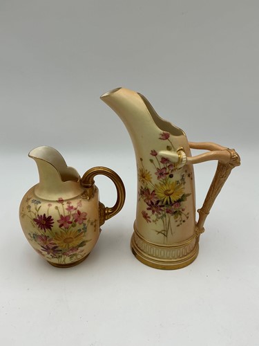 Lot 6 - Two Royal Worcester blush ivory ewers