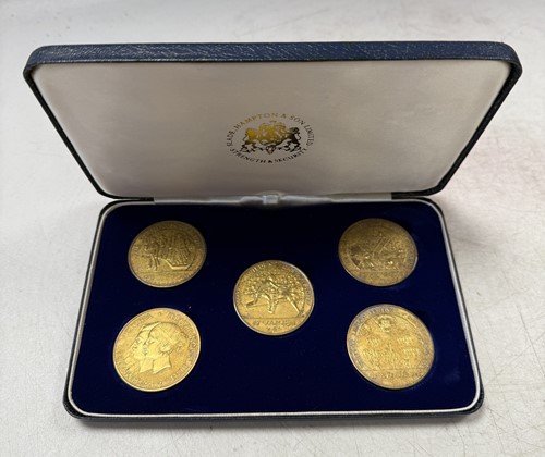 Lot 131 - Royal Mint for Hampton & Sons - A set of five silver gilt celebratory medals