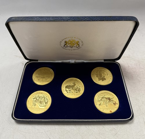 Lot 132 - Royal Mint for Hampton & Sons - A set of five 22ct gold celebratory medals
