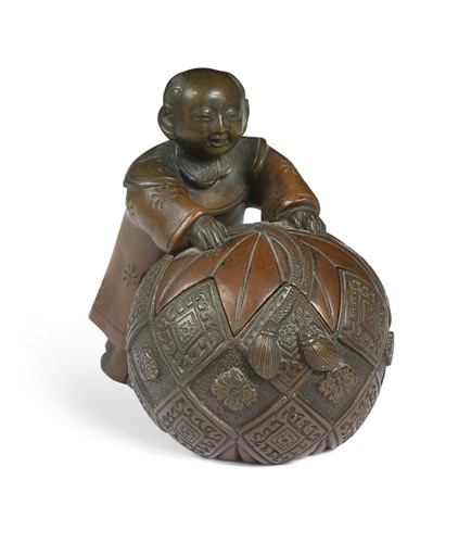 Lot 63 - A Japanese bronze okimono of a boy with an oversized tasselled ball box, Meiji Period (1868-1912)
