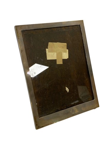 Lot 251 - A silver photograph frame with wooden back and...