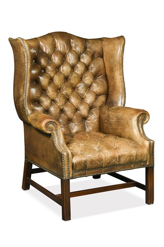 Lot 576 - A George III style wingback armchair, 20th century