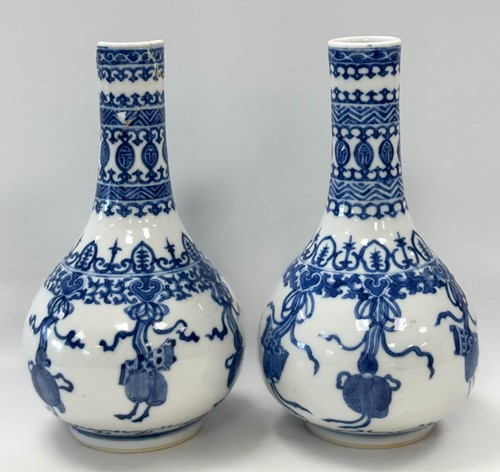 Lot 16 - A pair of Chinese blue and white porcelain bottle vases, Qing Dynasty, 19th century