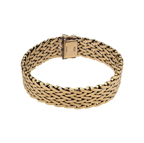 Lot 81 - A late 20th century 9ct gold wide bracelet