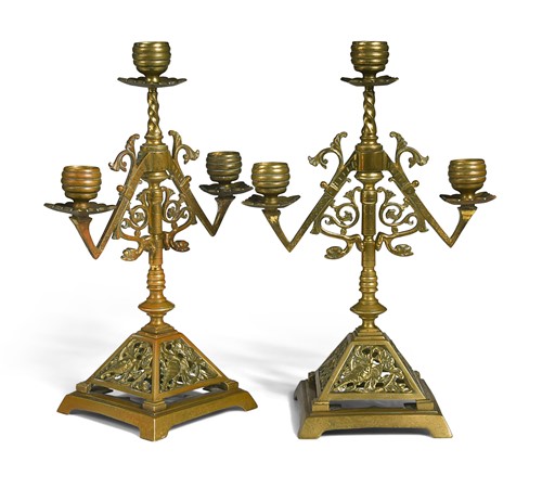Lot 190 - A pair of Aesthetic Movement three-light candelabra