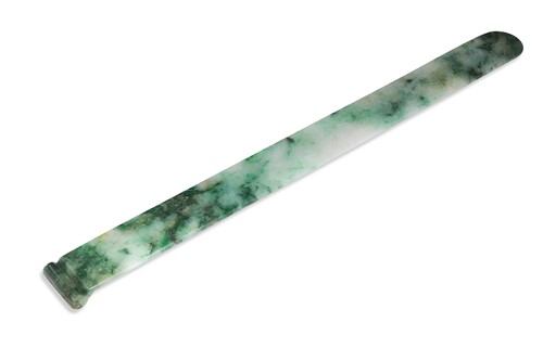 Lot 38 - A Chinese jadeite wrist rest or page turner, early 20th century