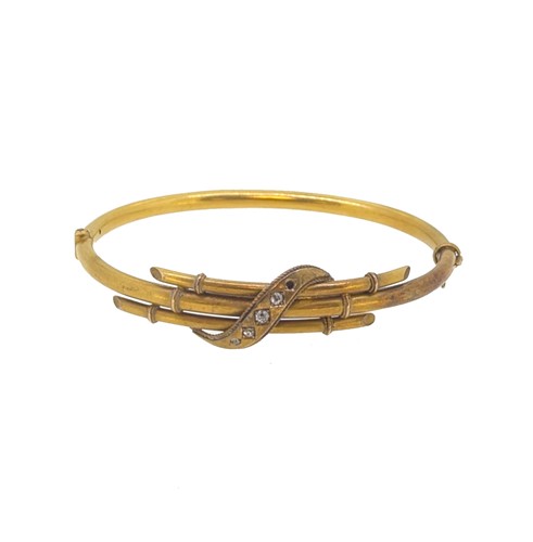 Lot 68 - An Edwardian diamond set bangle