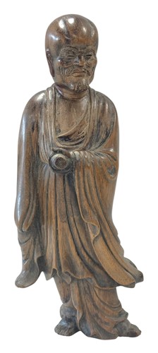 Lot 44 - A Chinese carved hardwood statuette of a standing Arhat, late Qing Dynasty