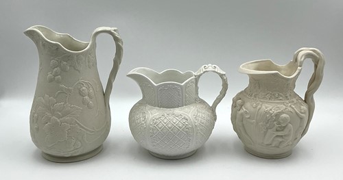 Lot 30 - Three 19th century Parian jugs, the tallest...
