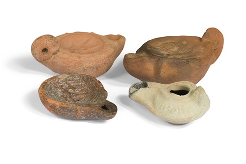 Lot 696 - A Roman Byzantine terracotta slipper lamp, circa 5th-8th century A.D