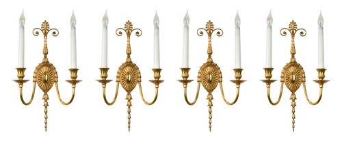 Lot 610 - A set of four Neo-Classical style gilt brass two-branch wall brackets, late 20th century