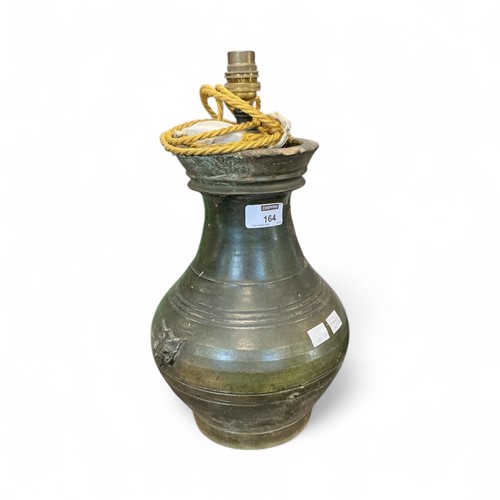 Lot 164 - A Chinese Han style green glazed baluster vase,...