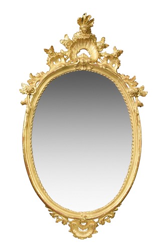 Lot 665 - A carved and gilded oval wall mirror, 19th century