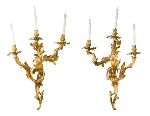 Lot 572 - A pair of Louis XV style ormolu three-light wall brackets, early 20th century