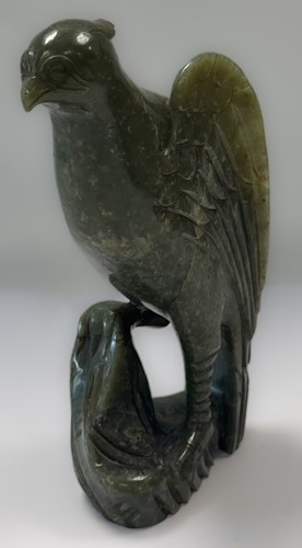 Lot 37 - A Chinese nephrite perched hawk, late Qing Dynasty