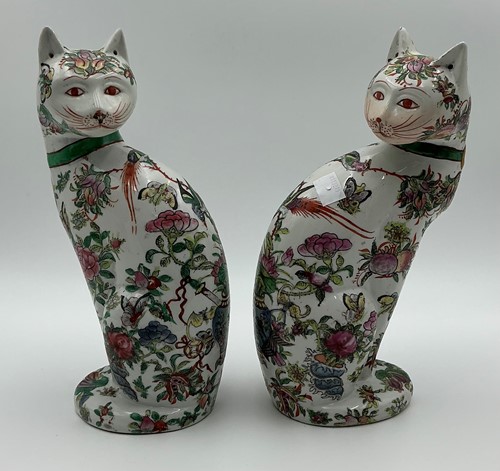 Lot 28 - A pair of porcelain famille rose cats in the...