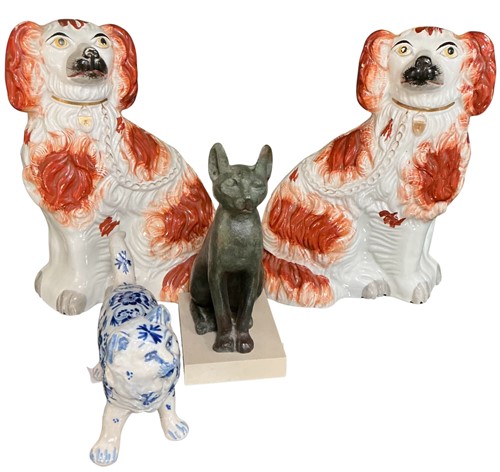 Lot 9 - A blue and white glazed pottery cat, decorated...