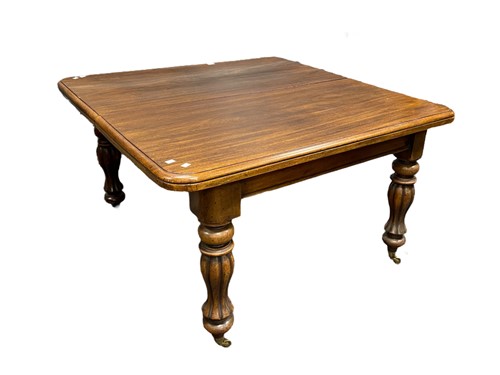 Lot 535 - A mahogany dining table with fluted bulbous...