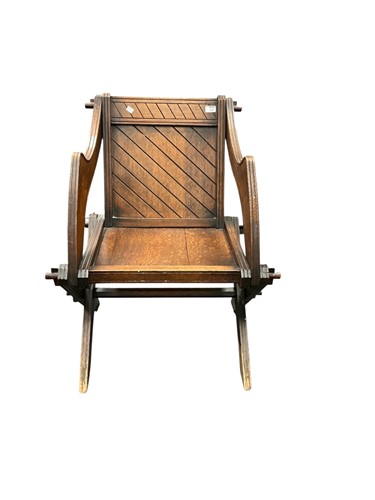 Lot 427 - A Glastonbury type oak armchair after designes...