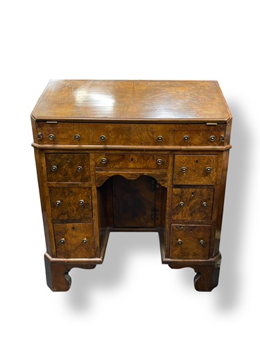 Lot 444 - A Queen Anne revival walnut bureau with a fall...