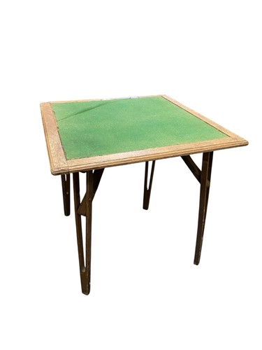 Lot 531 - An oak travelling card table by Velock with...
